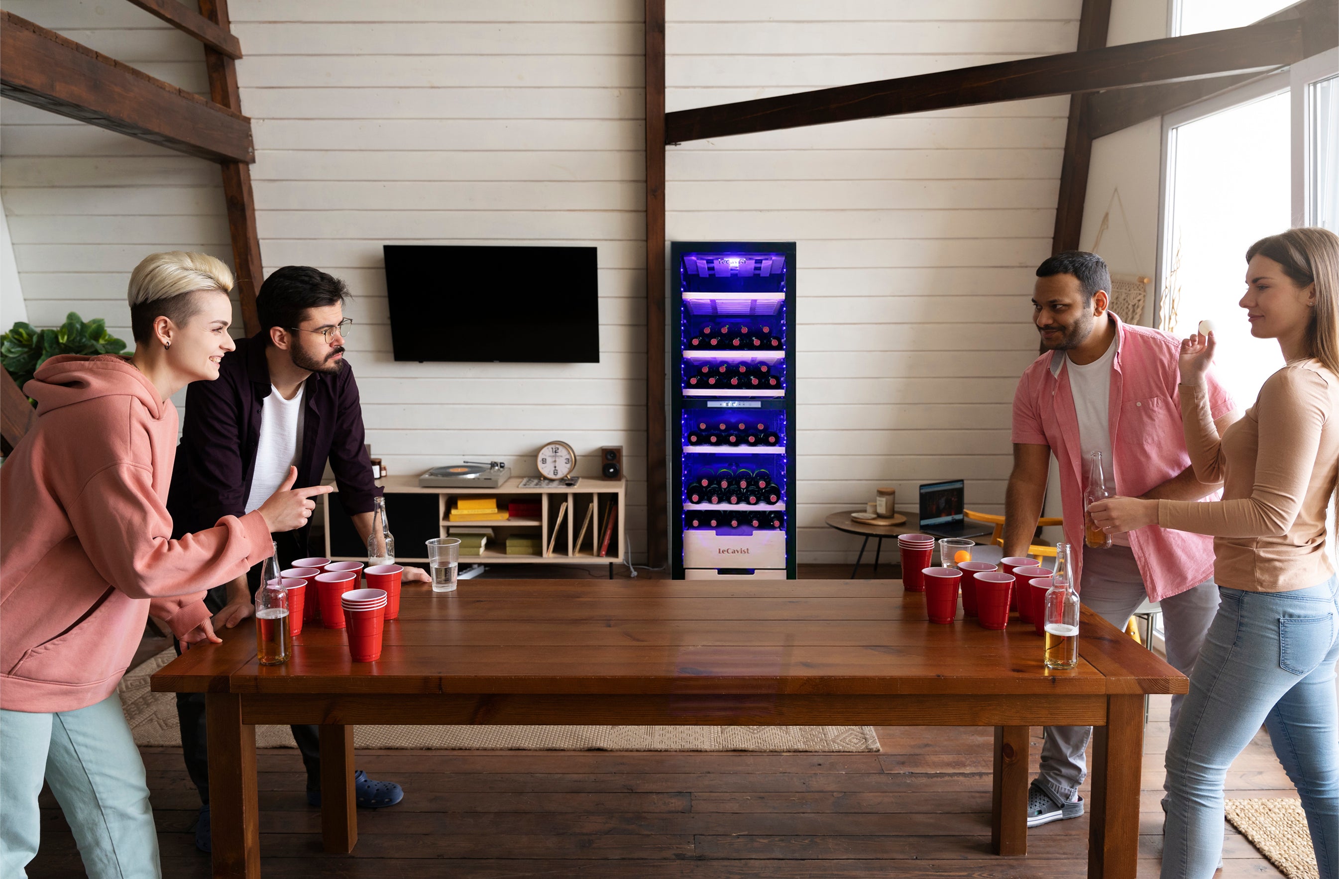 Friends are having fun together with chilled wine from LeCavist wine Cabinet